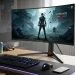An Alienware curved gaming monitor on a desk displaying the game The Witcher 3 Wild Hunt.