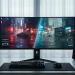 An ultrawide gaming monitor on a clean desk displaying a vibrant, neon-lit city scene.
