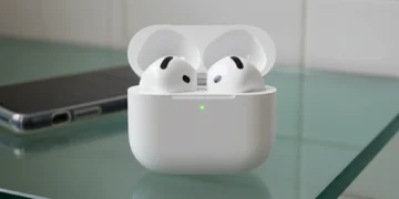 AirPods 4 hardware data showing the open charging case on a glass countertop without silicone tips.