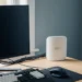 Amazon eero Pro 7 hardware positioned in the rear corner of an organized home office desk with managed cables