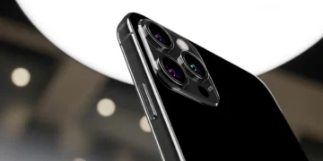 Left leaning profile of the iPhone 16 Pro in Black Titanium showcasing the vertical rails and hardware required to bridge the iphone 16 pro software gap.