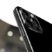 Left leaning profile of the iPhone 16 Pro in Black Titanium showcasing the vertical rails and hardware required to bridge the iphone 16 pro software gap.